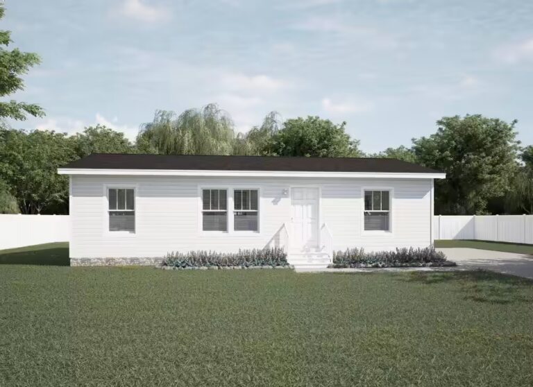 White single-story house with dark roof on green lawn, surrounded by white fence and trees.